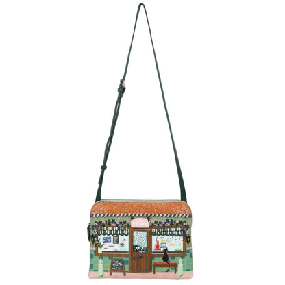 Crossbody bag with a design of a street scene on a white background
