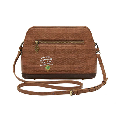 Brown crossbody bag with embroidered text and design on a white background