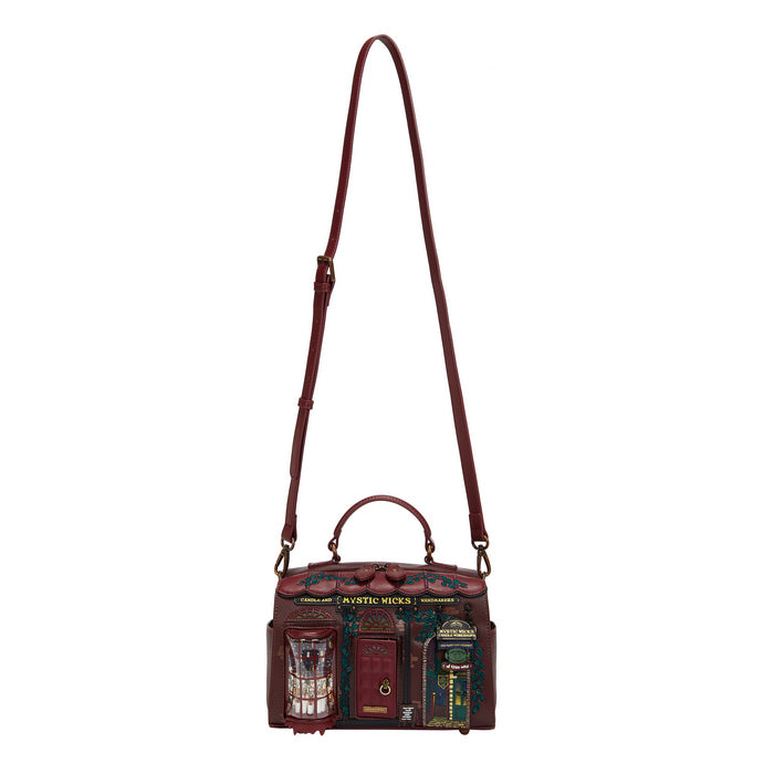 Brown leather handbag with a unique design on a white background