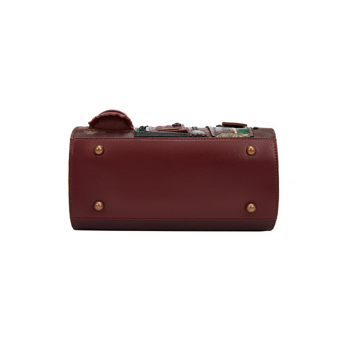Brown leather bag with gold studs on a white background