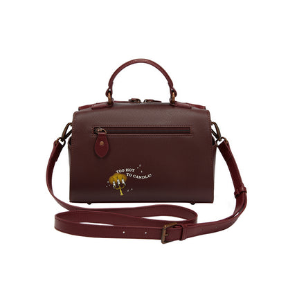 Brown handbag with a strap on a white background