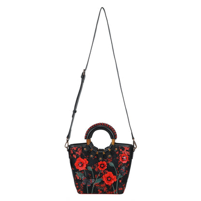Black handbag with red floral patterns on a white background
