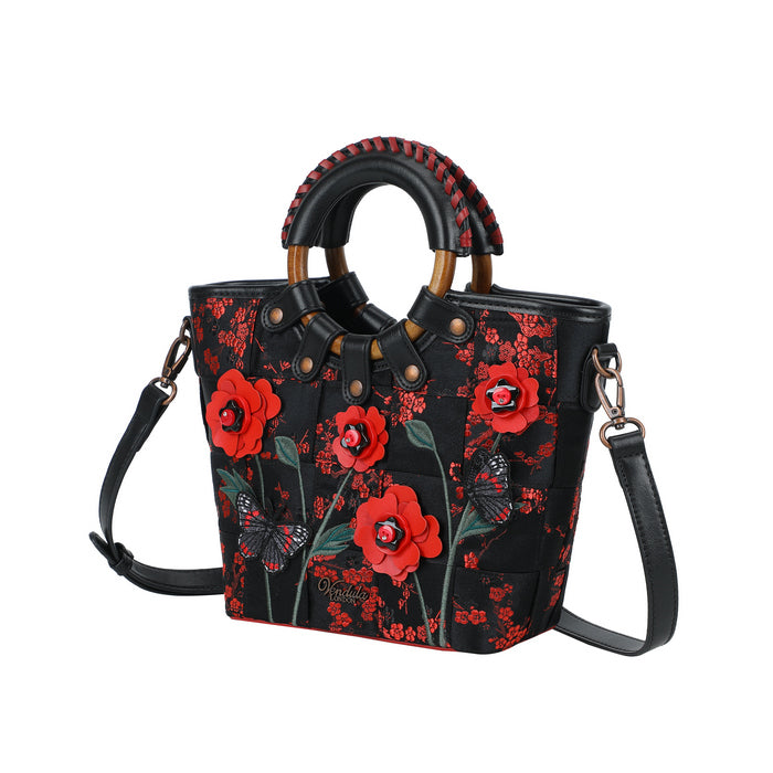 Black handbag with red floral patterns on a white background