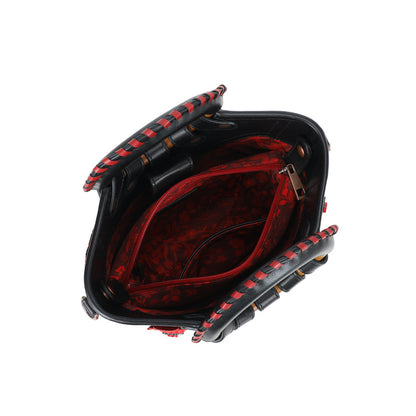 Black and red handbag with open design on a white background