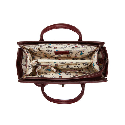 Brown handbag with a patterned interior on a white background