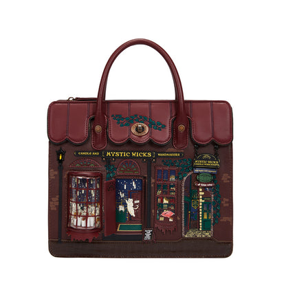 Brown leather bag with decorative design of a store front on a white background