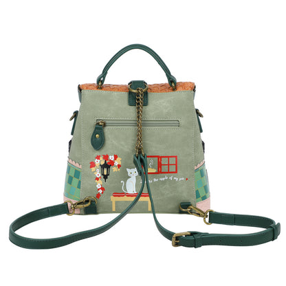 Green handbag with decorative elements on a white background