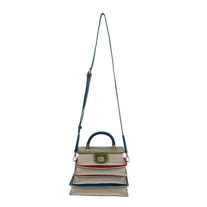 Multicolored handbag with a strap on a white background