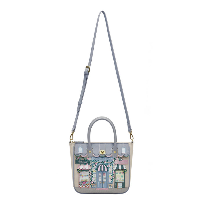 Handbag with a detailed design of a street scene on a white background