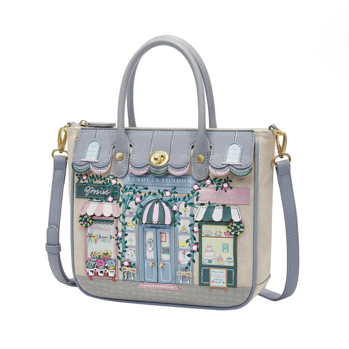 Handbag with a detailed design of a street scene on a white background