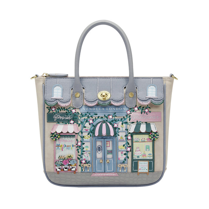 Handbag with a detailed design of a street scene on a white background