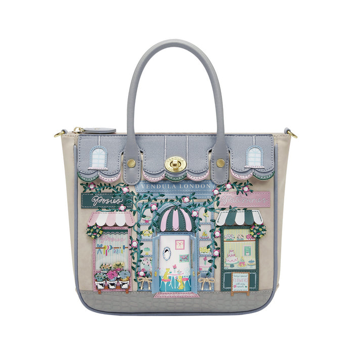 Handbag with a detailed design of a street scene on a white background