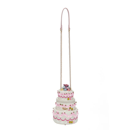Three-tiered cake-shaped bag with pink details on a white background