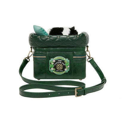 Green quilted handbag with a brand logo on a white background