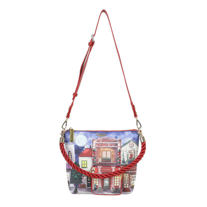 Handbag with a street scene design and red strap on a white background