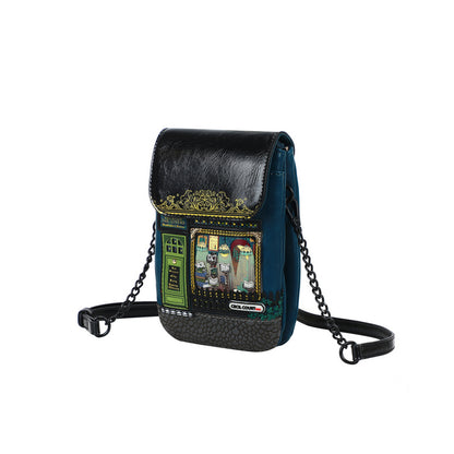 Black and blue crossbody bag with decorative elements on a white background