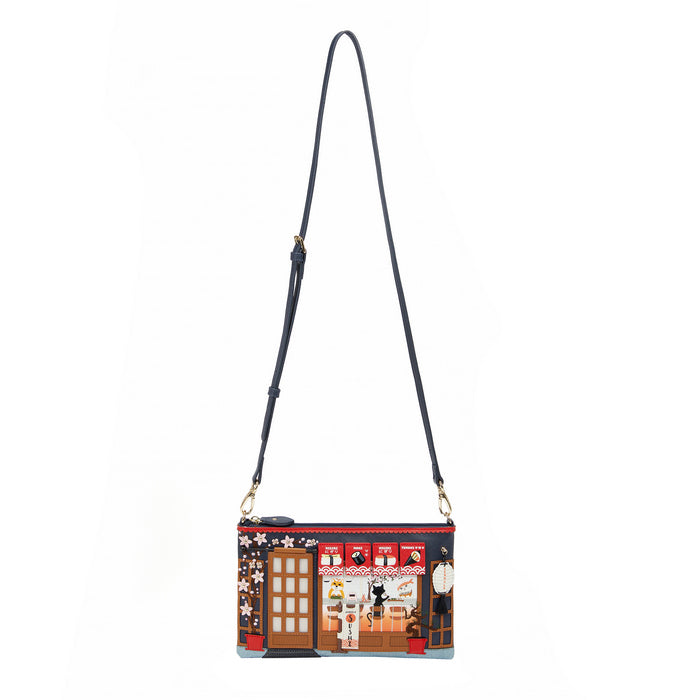 Crossbody bag with a design of a street scene on a white background