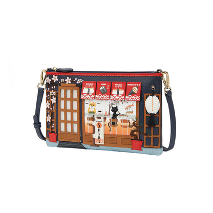 Handbag with a design of a store front and cat, on a white background
