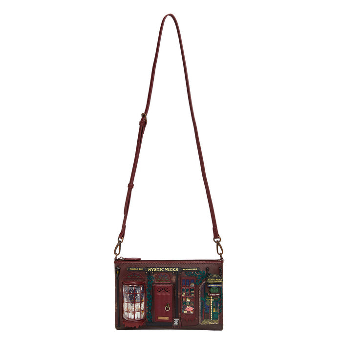 Crossbody bag with a detailed design on a white background