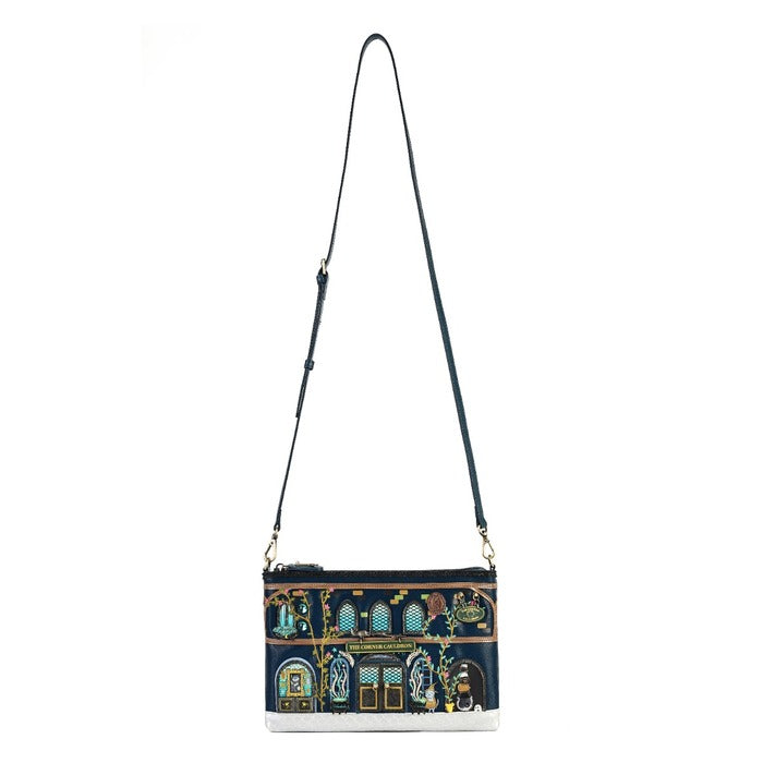 A navy blue crossbody bag with an intricate multicolor architectural illustration on the front panel and a long black shoulder strap, shown against a plain white background.