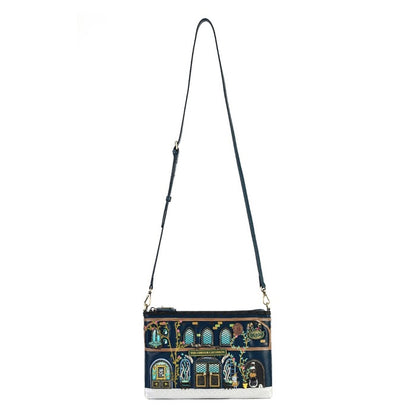 A navy blue crossbody bag with an intricate multicolor architectural illustration on the front panel and a long black shoulder strap, shown against a plain white background.