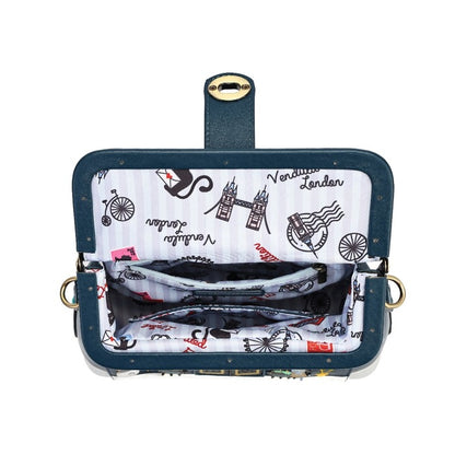 An open navy blue shoulder bag with a London-themed print lining. The exterior features a dark teal-blue fabric with gold-tone studs and a gold clasp, while the interior lining is white with black illustrations of Tower Bridge, a black cat, and the word 'London'.