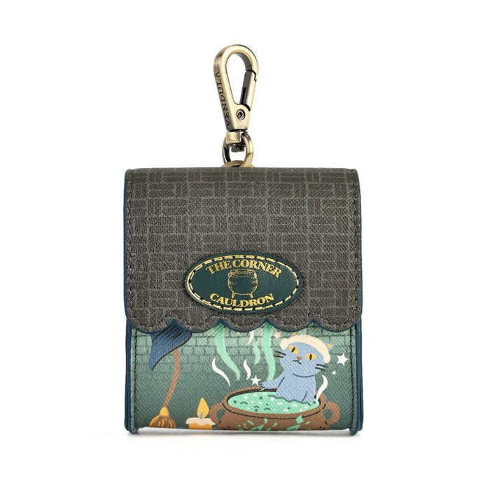 A compact case for small tech or everyday essentials, secured with a magnetic closure and fitted with clip hardware for easy attachment. Printed vegan leather carries potion bottles, cauldrons, cats, cobwebs, moonlit windows and dark teal details in miniature.