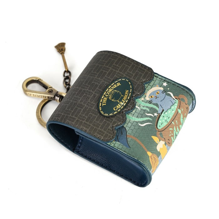 A small bifold wallet with a dark brown textured exterior, a colorful illustrated side panel featuring a blue sea creature and green waves, and a brass keychain ring attached on a white background.