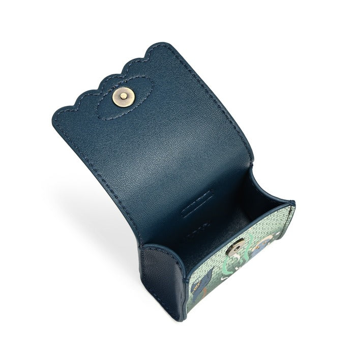 A navy blue leather pouch shown open, featuring a scalloped edge, a snap button closure, and a light green patterned interior lining.