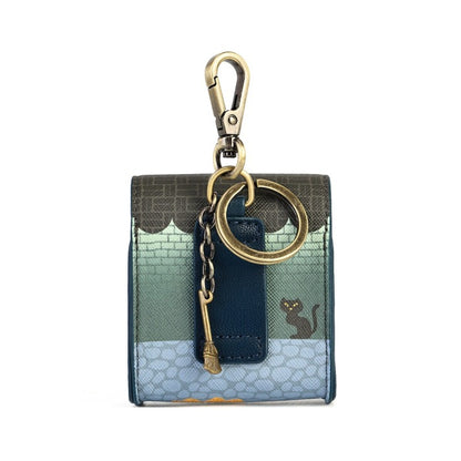 A small rectangular keychain wallet with a multicolor patchwork design featuring a dark green top section, a teal brick-patterned middle section, and a light blue bottom section. It has a dark blue leather tab with a small black cat illustration, gold-tone hardware including a carabiner, key ring, and chain.