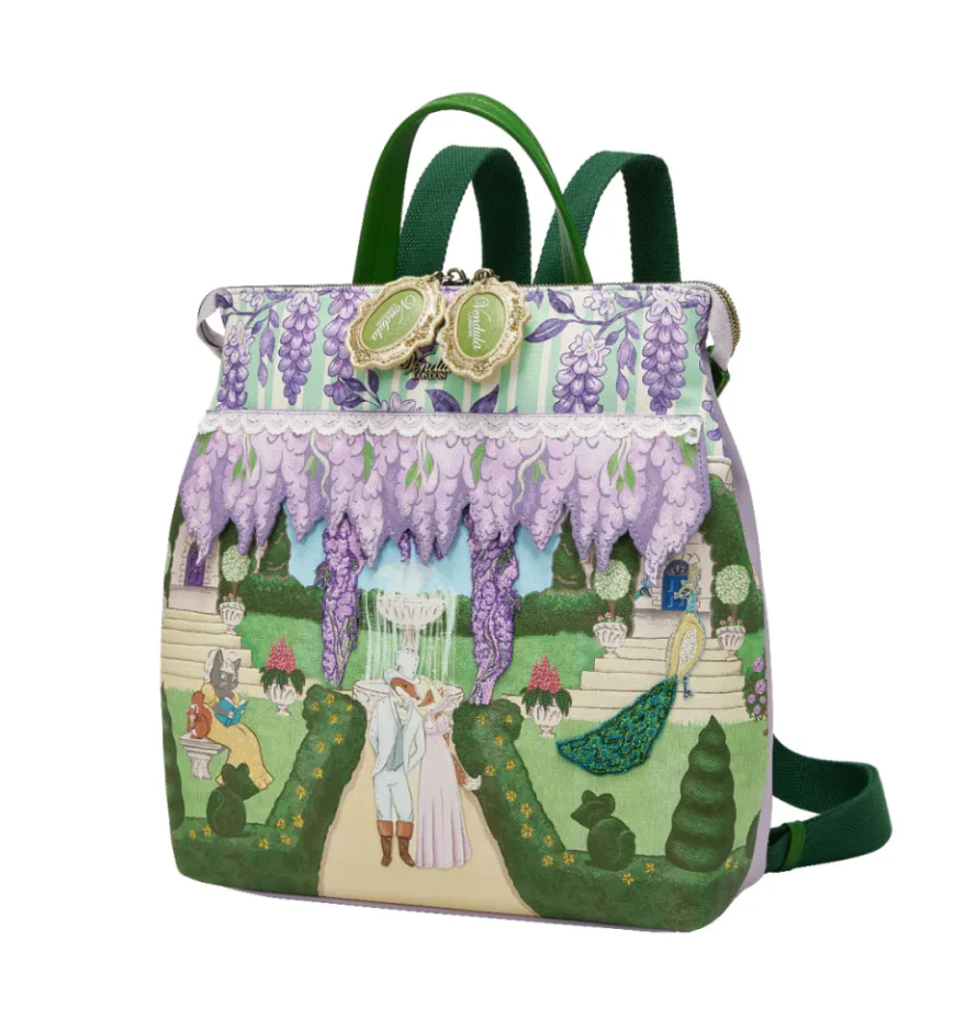 Person wearing a colorful backpack with a garden scene design.