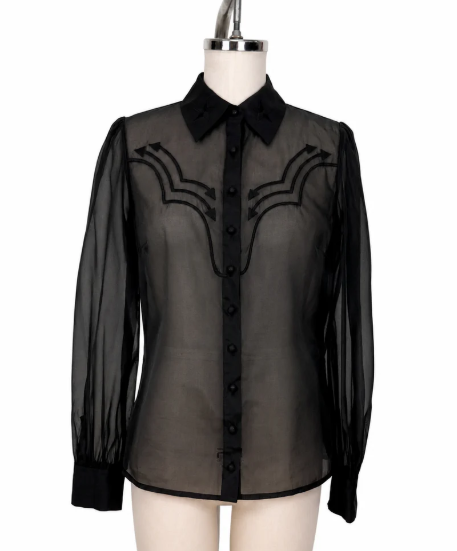 Black sheer blouse with embroidered details on a mannequin against a white background