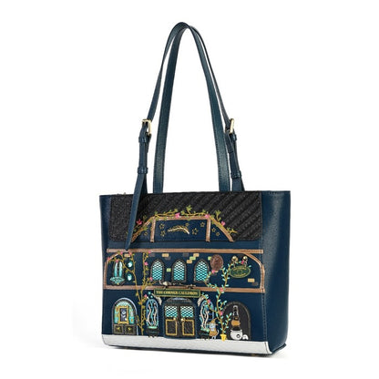 A navy blue tote bag featuring a detailed, colorful illustration of a building facade on the front panel, with dark blue shoulder straps and gold-tone hardware, shown against a plain white background.
