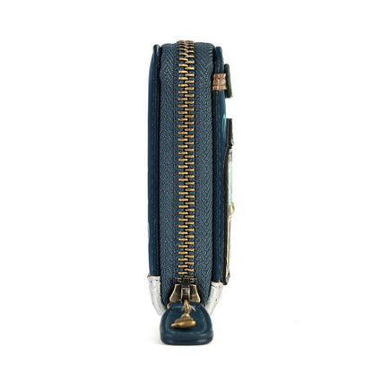 A close-up side view of a dark teal textured leather wallet with a prominent gold zipper and a silver-toned metal pull tab.