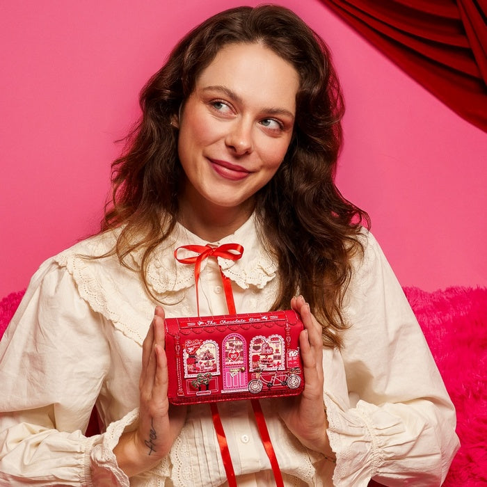 A neatly organised wallet with space for cards, notes, and coins. Compact and easy to carry, it fits comfortably into most bags.