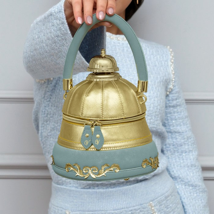 A sculptural round bag with a structured shape and working bell detail.