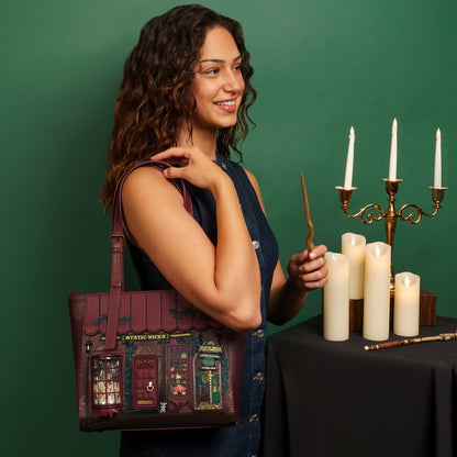 Woman holding a themed handbag with candles and a candelabra in the background