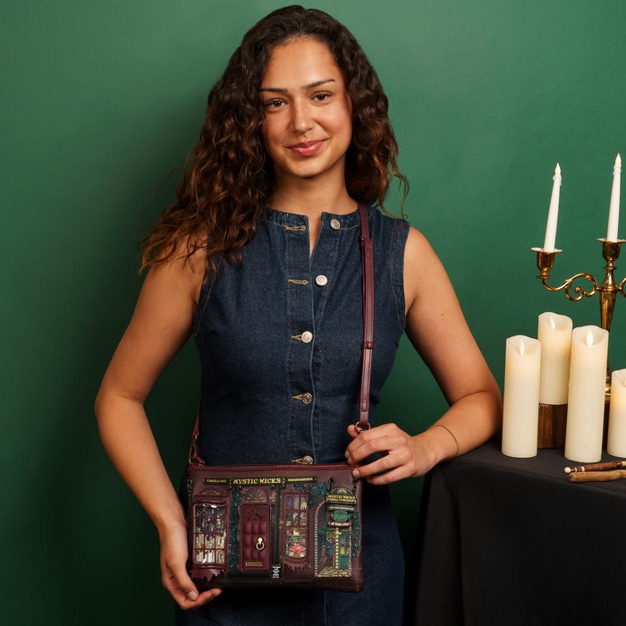 Woman holding a decorative bag with candles and a candelabra in the background