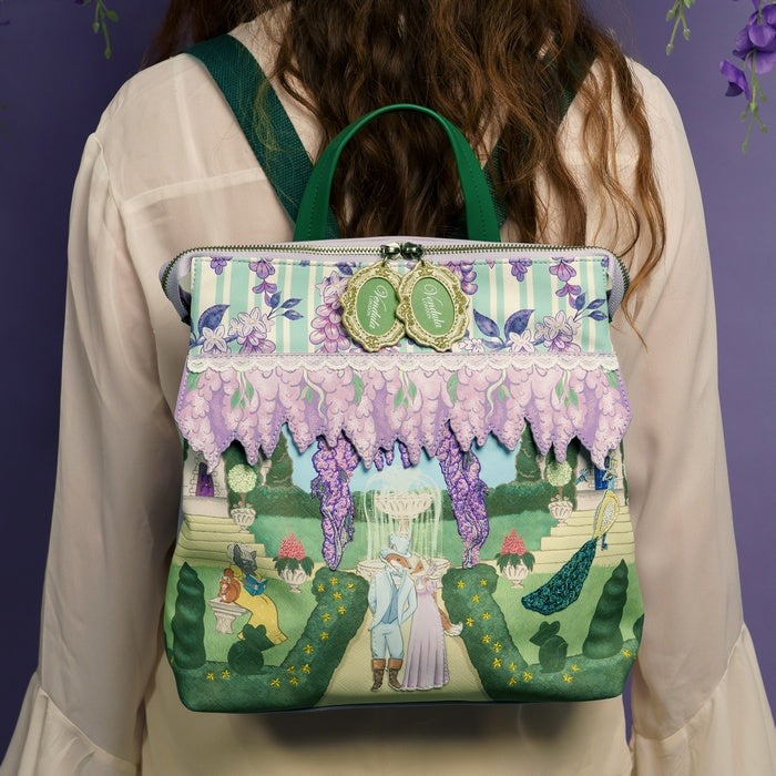 Person wearing a colorful backpack with a garden scene design.