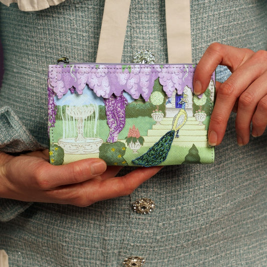 Person holding a wallet with garden design