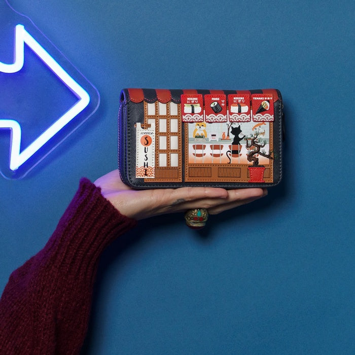 Hand holding a wallet with a unique design against a blue background with a neon arrow.