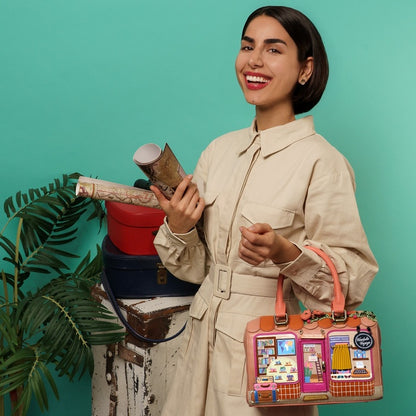Woman holding a colorful handbag with a turquoise background