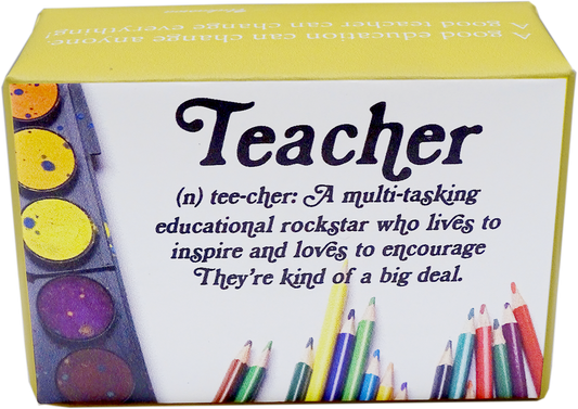 A boxed novelty tee-shirt product with a yellow top and side panels, a white front panel, and printed text reading 'Teacher (n) tee-cher: A multi-tasking educational rockstar who lives to inspire and loves to encourage. They're kind of a big deal.