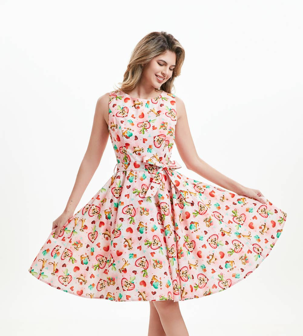 A woman wearing a knee-length sleeveless linen fit and flare dress with meerkat print pockets, a boat neckline, and an invisible zipper in the back. christmas dress xmas