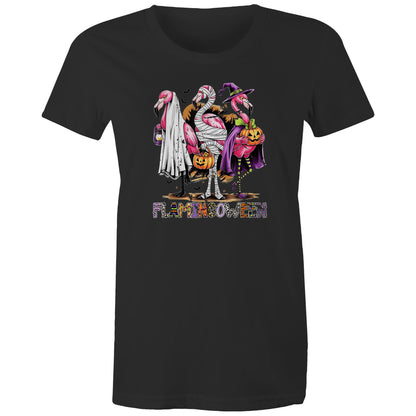 A white t-shirt featuring a colorful graphic of three cartoon flamingos dressed in Halloween costumes. One flamingo wears a white ghost and lantern, another is wrapped in bandages and holds a pumpkin bucket, and the third wears a purple witch hat and cape while holding a jack-o'-lantern.