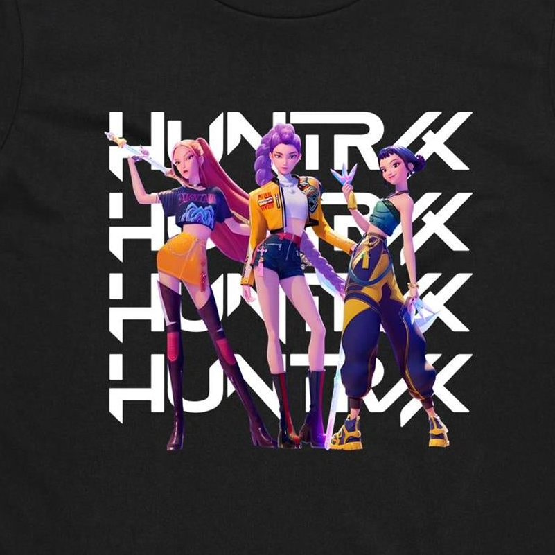 A close-up of a black t-shirt featuring a graphic print of three stylized female characters in colorful outfits, overlaid with the word 'HUNTER' repeated vertically in bold white letters.