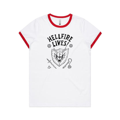 White ringer t-shirt with a red collar trim, featuring a black graphic print of a horned skull on a shield, the text 'HELLFIRE LIVES!', and fantasy-themed icons including dice, a sword, and a mace.