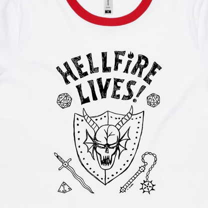 White ringer t-shirt with a red collar trim, featuring a black graphic print of a horned skull on a shield, the text 'HELLFIRE LIVES!', and fantasy-themed icons including dice, a sword, and a mace.