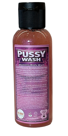 A bottle of 'Pussy Wash' women's body wash with a black cap and a purple label, containing a pinkish-brown liquid, shown against a plain white background.