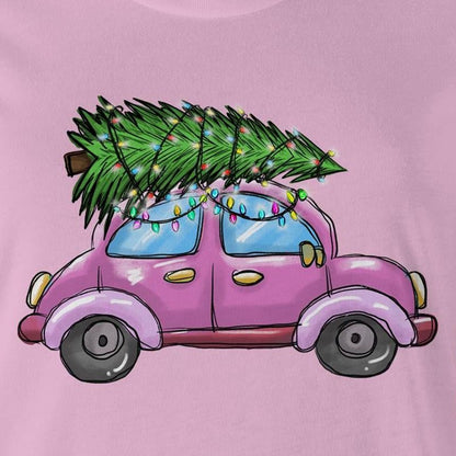 A pink women's t-shirt with a printed image of a Christmas tree on the front, resembling a car, on a marled background.
